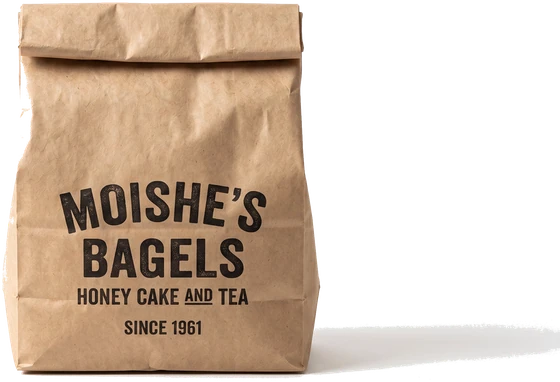 A paper bag printed Moishe&rsquo;s Bagels, honey cake and tea, since 1961.